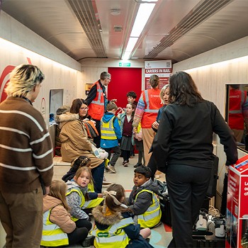 Children enjoying there time on the train with school staff
