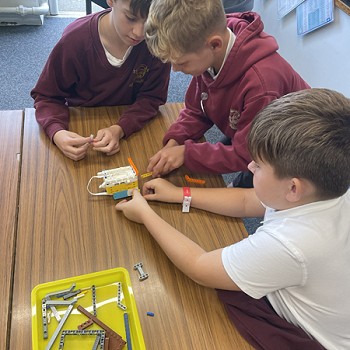 students building robots with lego