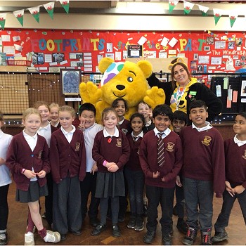 Pudsey Bear with group Blessed William Davies pupils standing in a classroom