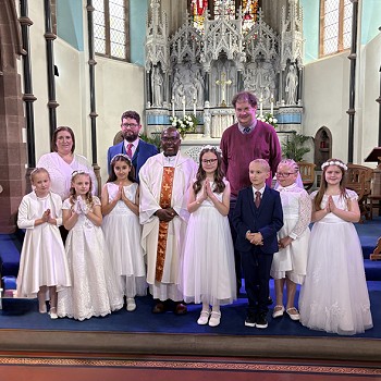 group on the stage for the First Holy Communion