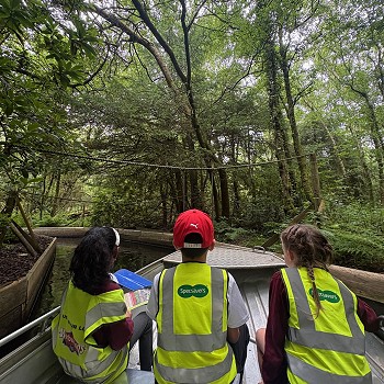 3 students on a boat